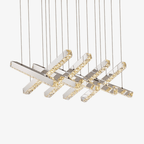 Maison Ornate Modern Crystal Chandelier with angled rectangular LED bars and glass tassels, emitting warm light.