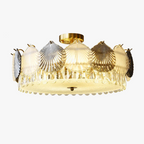 French modern chandelier with gold and silver seashell accents, glass base, LED lighting.