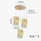 Round gold chandelier with three crystal LED pendants, adjustable cords, 35cm canopy, E14 bulbs.