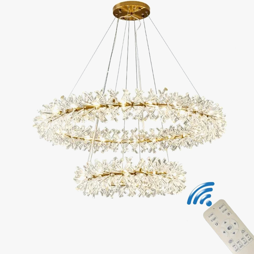 Maison Ornate chandelier with two-tier gold-accented LED crystal rings, suspended by cables.