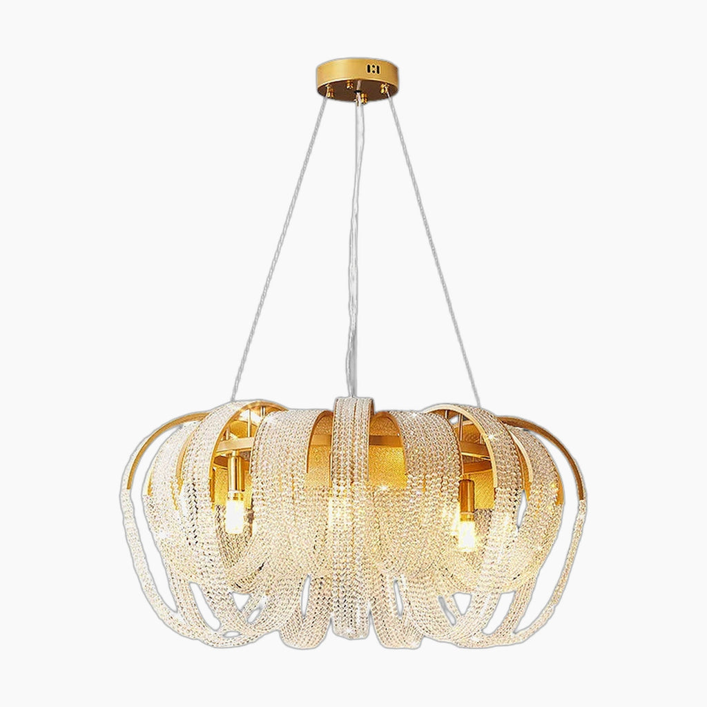 Crystal chandelier with curved arms, gold ceiling mount, white cords, and sparkling dimmable lighting.