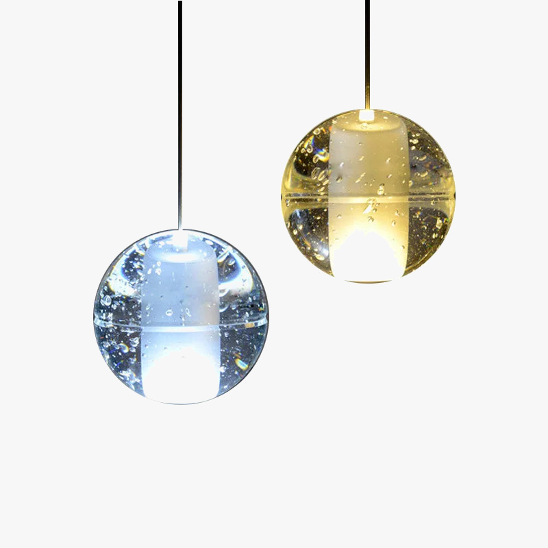 Two Maison Crystal Sphere Chandeliers, one cool white, one warm yellow, with rotating LED and bubble glass.