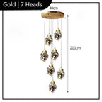 Elegant crystal chandelier with seven geometric LED pendants on a round base, modern and energy-efficient.