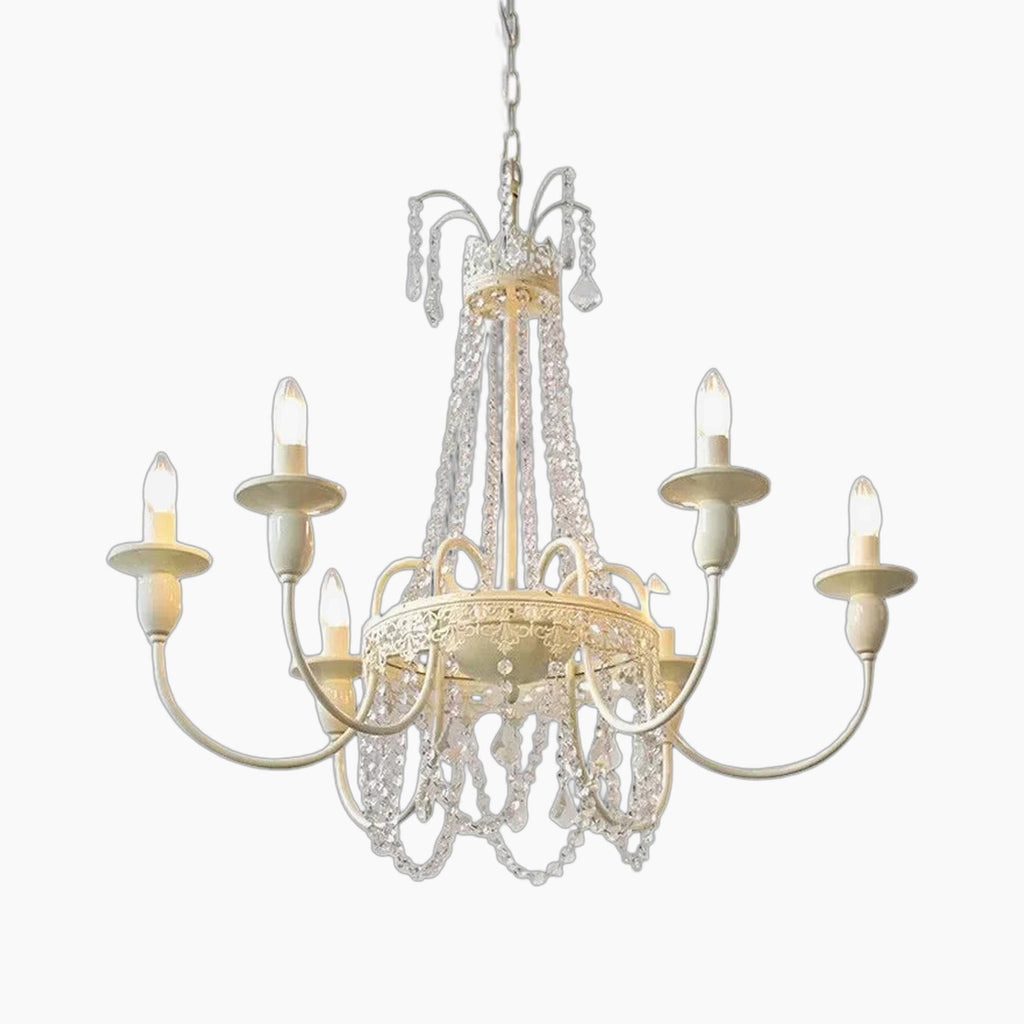 Ornate French-style chandelier with six candle lights, gold detailing, and draped crystal chains.