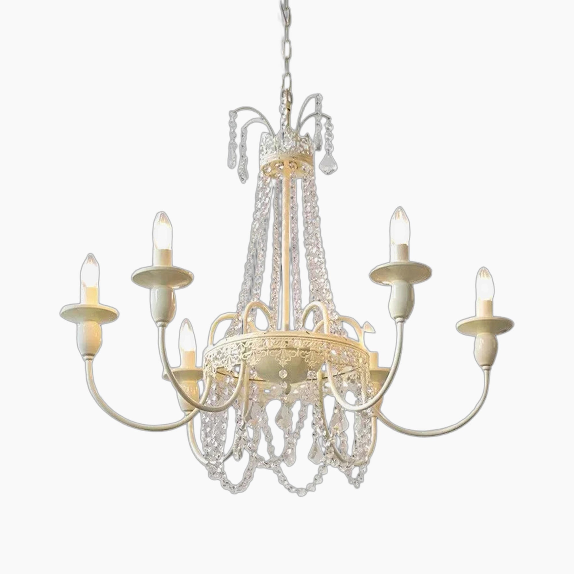Ornate French-style chandelier with six candle lights, gold detailing, and draped crystal chains.