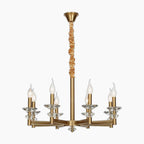 Gold-finished retro iron chandelier with six glass candle bulbs and tan fabric-wrapped central rod.