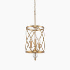 Gold swirling frame chandelier with three candle lights, crystal accent, and matching gold chain.
