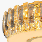 Close-up of Maison Ornate Dimmable LED Chandelier, gold and clear crystals reflecting warm light.