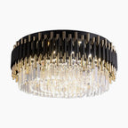 Modern LED crystal chandelier with round black and gold frame, vertical rods, and clear prisms.