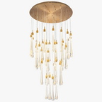 Round gold mount chandelier with cascading glass droplets, gold tips, adjustable height, and LED lighting.