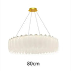 Ornate crystal ball chandelier with decorative feathers, layered glass, gold mount, 80cm diameter.