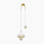 Gold ceiling mount chandelier with twin cords, butterfly accent, and crystal-globe for modern elegance.