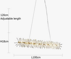 Modern round chandelier with sparkling crystals, 100cm long, emits warm light from adjustable cables.
