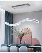 Maison Ornate Modern Crystal Chandelier with stainless steel bands and sparkling crystals suspended elegantly.