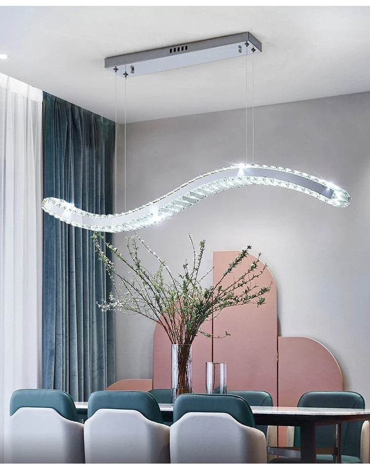 Maison Ornate Modern Crystal Chandelier with stainless steel bands and sparkling crystals suspended elegantly.