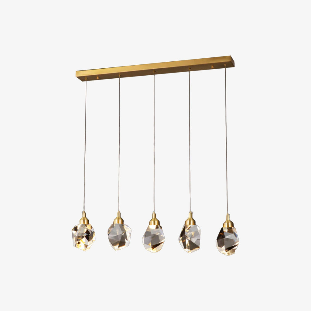 Gold-based chandelier with five faceted crystal bulbs and teardrop accents, elegantly suspended.