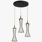 Three modern pendant lights with black wireframe shades and gold accents on a round mount.