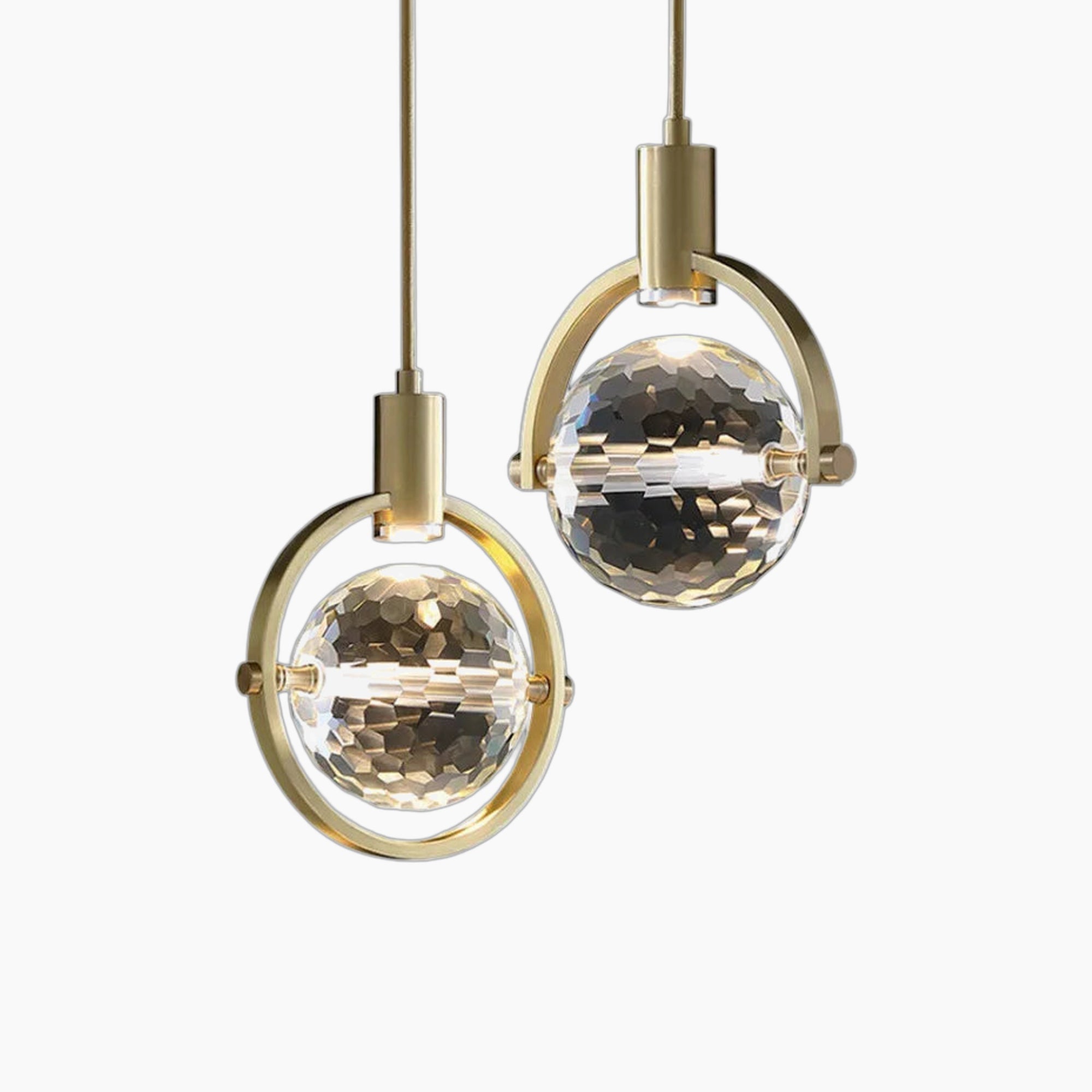 Maison Ornate chandelier with dual gold rings and faceted globes, suspended by slim cords.