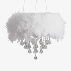 Round LED crystal chandelier with white feathers, tiered crystals, and elegant tassel accents.