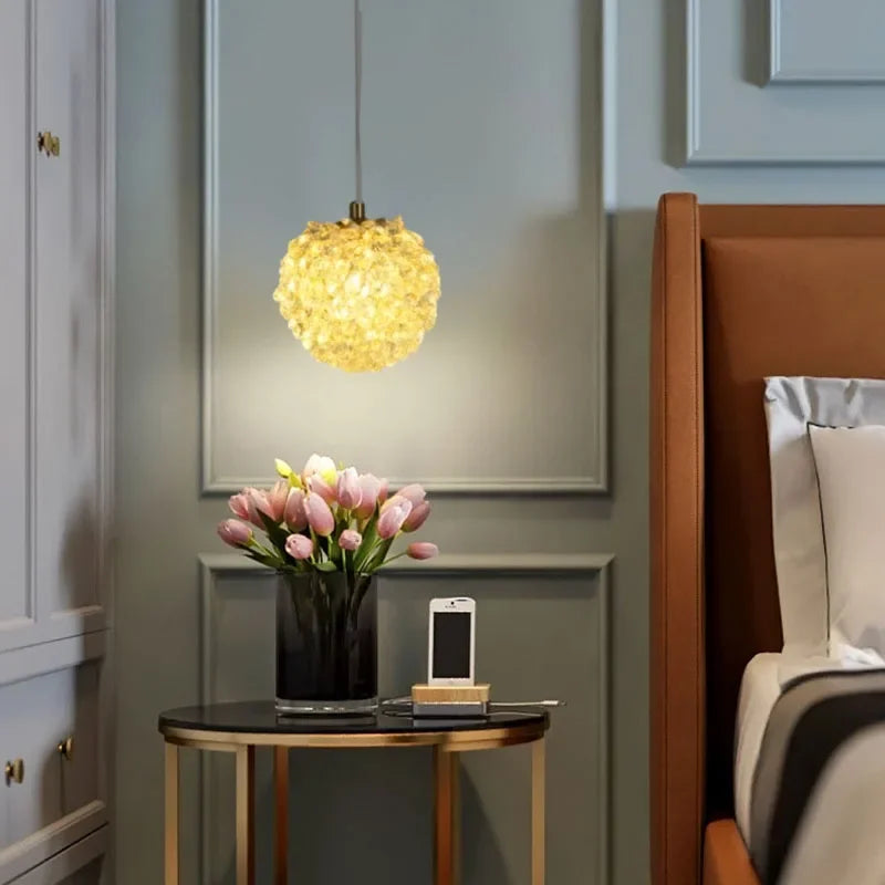 The Maison Ornate Modern Crystal Ball Chandelier features an artistic design and emits a warm glow.
