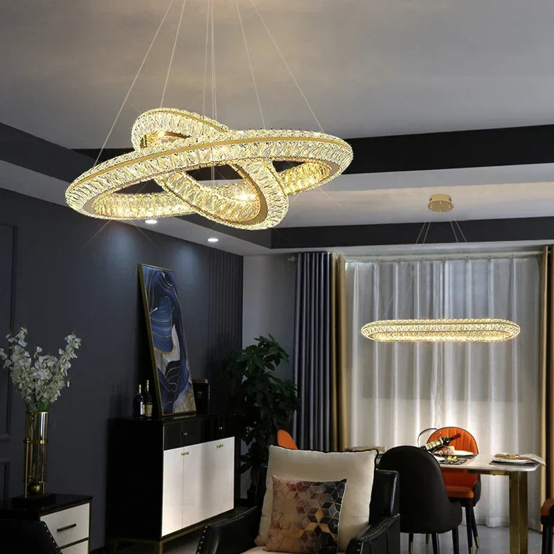 Two Maison Ornate Modern Crystal LED Chandeliers hanging overhead, showcasing elegant design and sparkling crystal details.