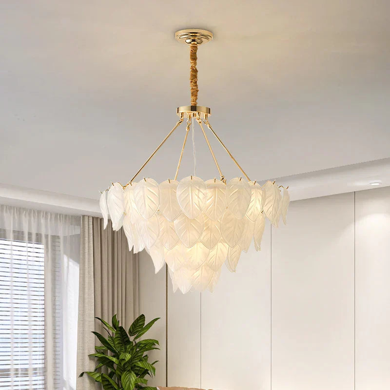 The Maison Ornate Vintage Gold Crystal Chandelier features a layered glass design and elegant gold detailing.