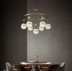 The Maison Ornate 2021 Modern Minimalist Crystal Hanging Light with seven globe-shaped bulbs.