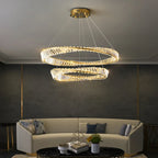 Maison Ornate Gold Crystal LED chandelier with two illuminated overlapping rings, sleek modern lighting.