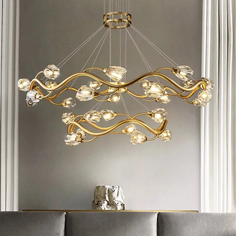 Maison Ornate Modern LED Crystal Pendant with gold wavy arms and crystal-like hanging fixtures.