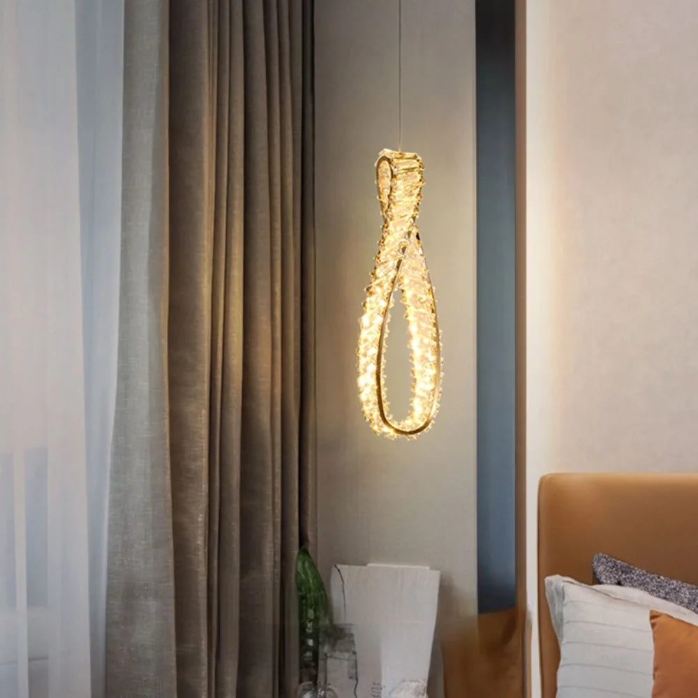 The Maison Ornate Modern LED Crystal Glass Chandelier features textured, glowing glass and elegant contemporary design.