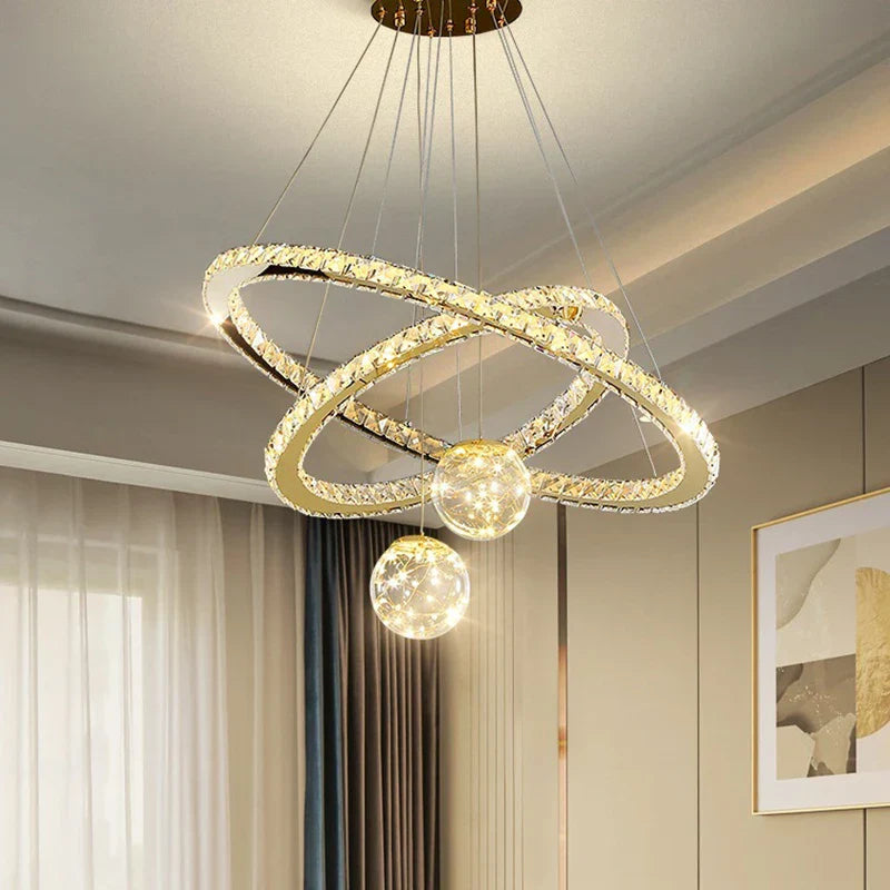 Maison Ornate Golden Crystal Chandelier with LED rings and glass balls in a modern design.