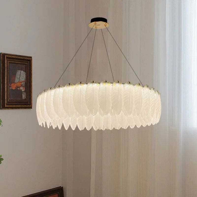 Maison Ornate crystal ball chandelier with glass accents and feather details hanging elegantly.