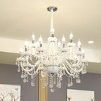 Curved glass tubes, candle bulbs, and hanging crystals define this ornate Nordic Baroque chandelier.
