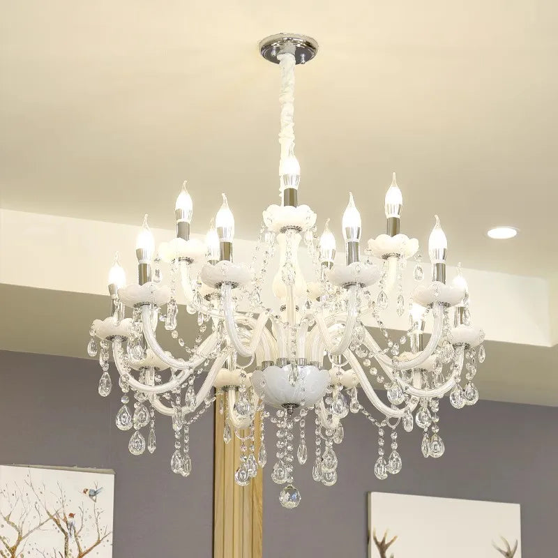 Curved glass tubes, candle bulbs, and hanging crystals define this ornate Nordic Baroque chandelier.