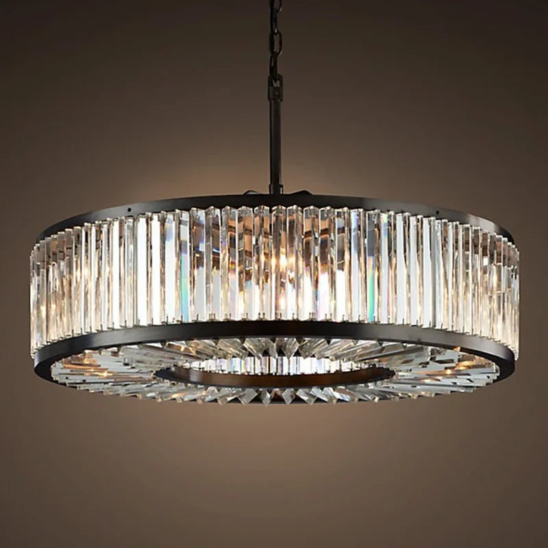 Maison Ornate crystal chandelier with black metal frame and vertical prisms, reflecting elegant luxury.