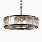 Black metal chandelier with vertical glass crystal prisms, sparkling reflections, elegant ornate vintage modern design.