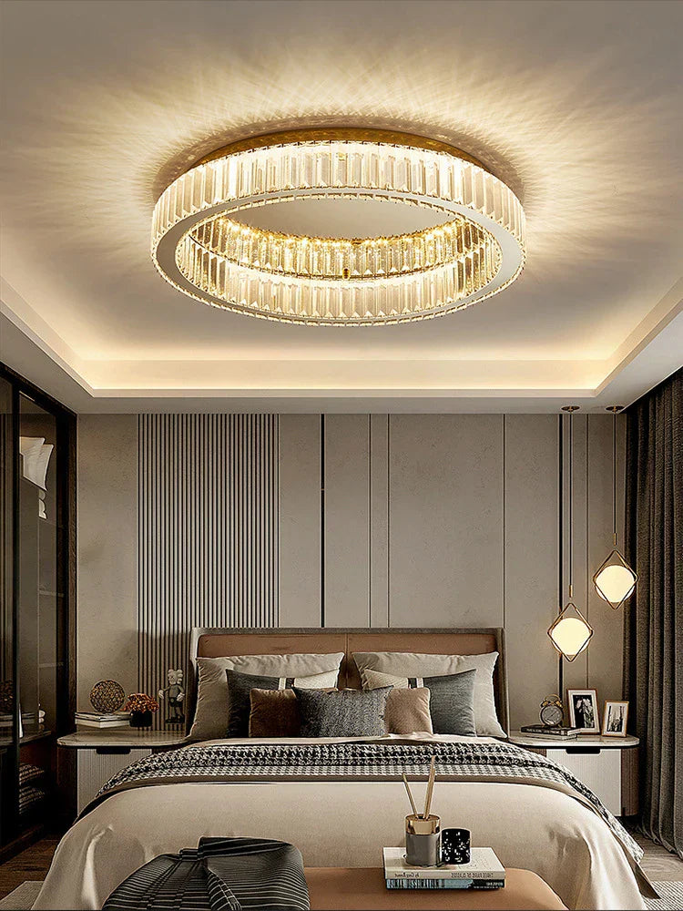 The Maison Ornate Dimmable LED Crystal Glass Round Chandelier hangs elegantly from the ceiling.