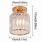 Gold-base Art Deco chandelier with vertical crystal rods, cylindrical shade, 17 cm tall, elegant design.