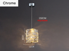 Dimmable LED crystal chandelier with textured chrome rings and adjustable 150cm hanging wire, emitting a warm glow.