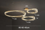 Three overlapping LED crystal rings 80cm, 60cm, 40cm suspended at varied heights.
