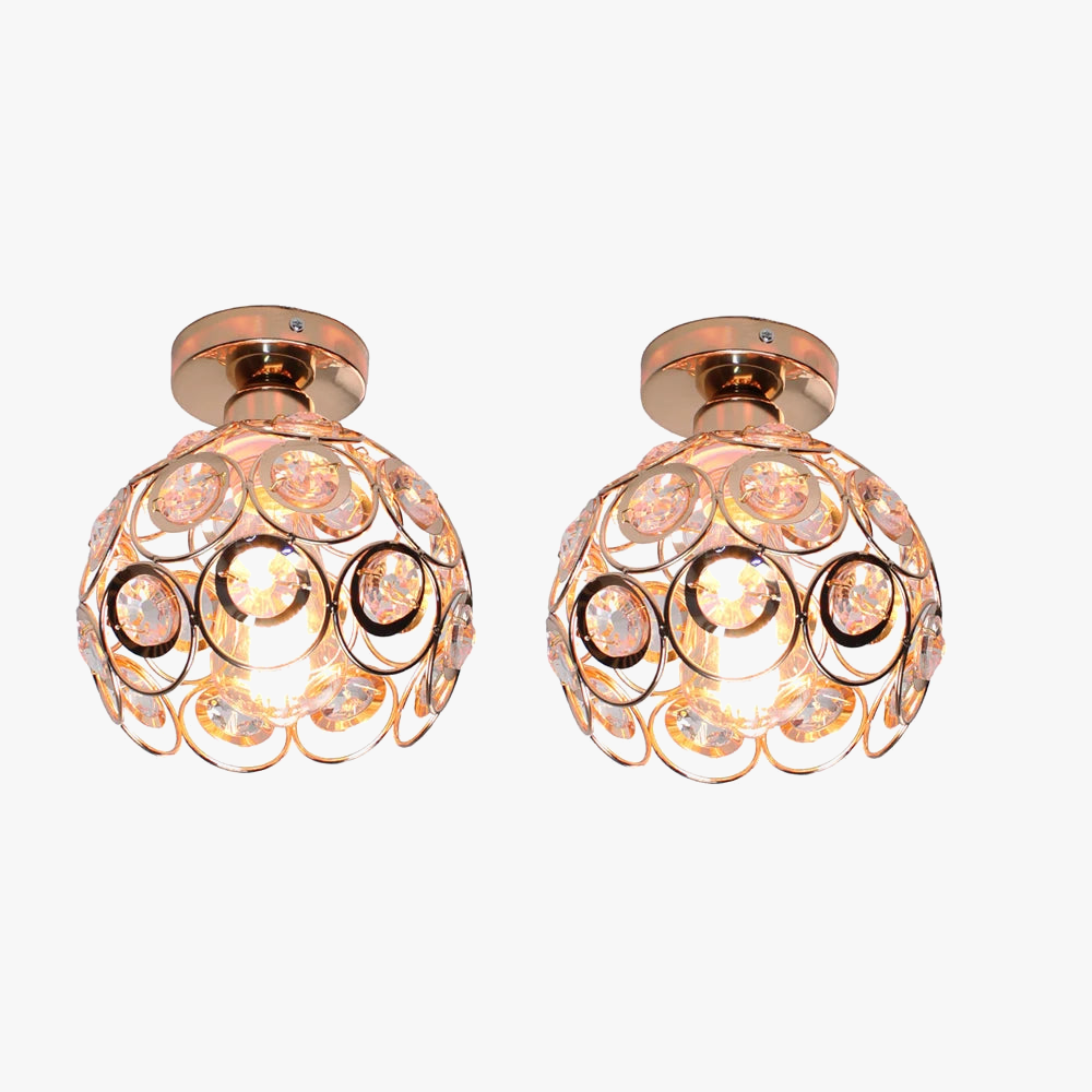 Gold-framed chandelier with circular crystal accents, casting a warm elegant glow overhead.
