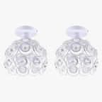 Two white semi-flush chandeliers with spherical cage frames and circular crystal accents.
