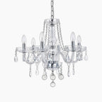 Maison Ornate Crystal Chandelier with chrome frame, 6 arms, K9 beads, candle bulbs, teardrop pendants.