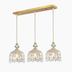 Three crystal pendant chandelier with elegant glass shades and gold mount in mid-century style.