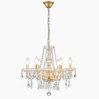 Six-light Baroque gold chandelier by Maison Ornate with crystals, candle-style bulbs, adjustable height.