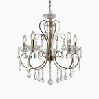 Maison Ornate Baroque Crystal Chandelier with gold tassels, metal arms, and sparkling glass pendants.