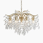 Gold chandelier with 9 adjustable arms, crystal droplets, and multiple bulbs for a sparkling effect.