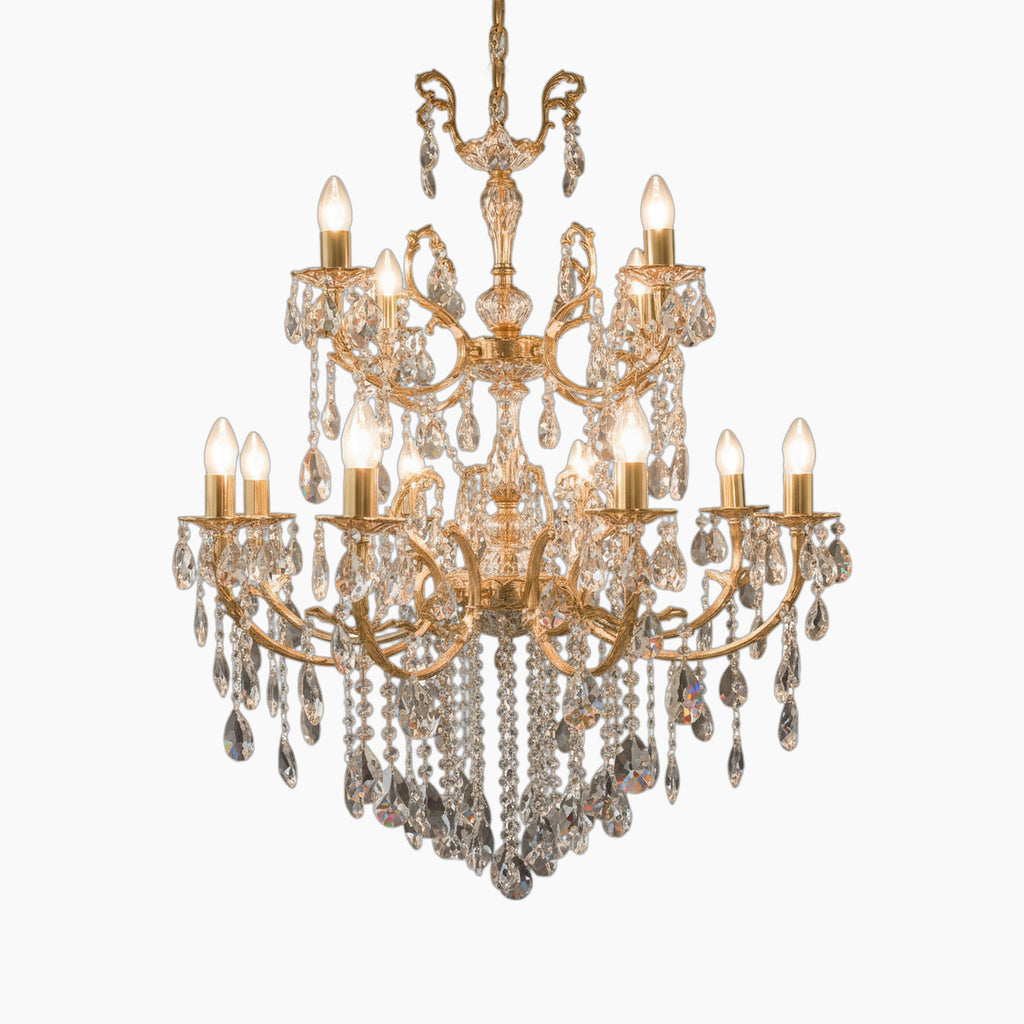 Multi-tier geometric gold chandelier with ornate arms, candle bulbs, and crystal droplets. Striking elegance.