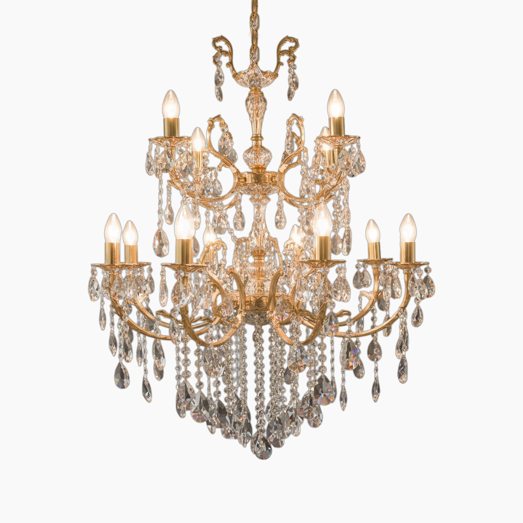 Multi-tier geometric gold chandelier with ornate arms, candle bulbs, and crystal droplets. Striking elegance.