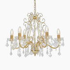 Eight-light golden crystal acrylic chandelier with ornate curved arms and dangling crystal pendants.